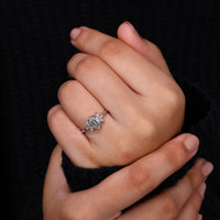4 claw prong setting on 7 stone diamond ring.