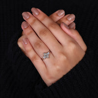 princess cut side stones set in 3 stone engagement ring.