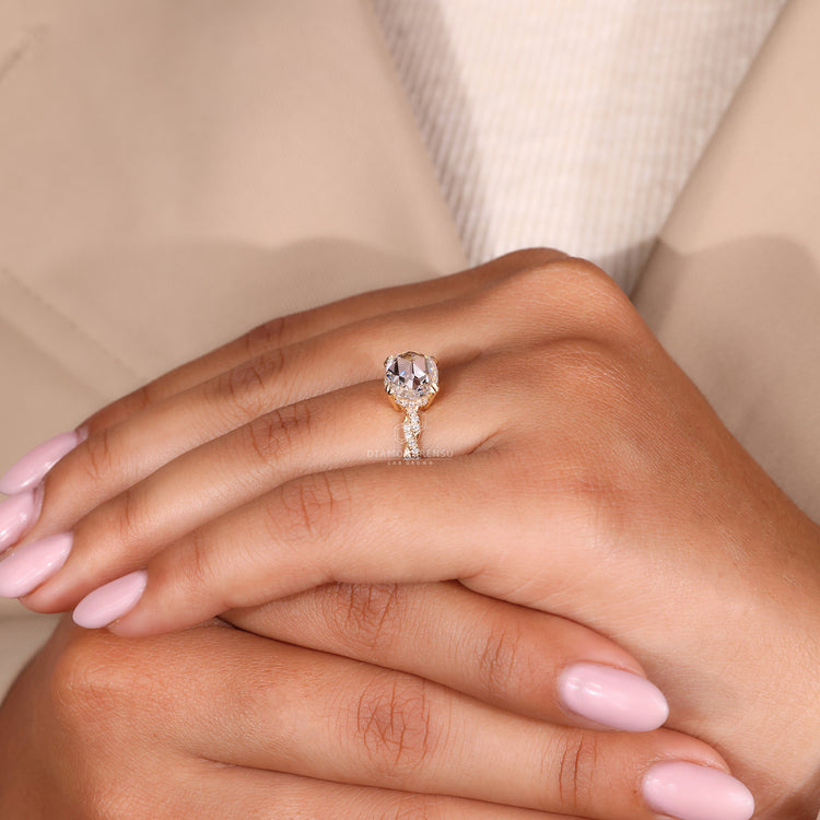 Hidden halo ring featuring an oval rose cut diamond center.