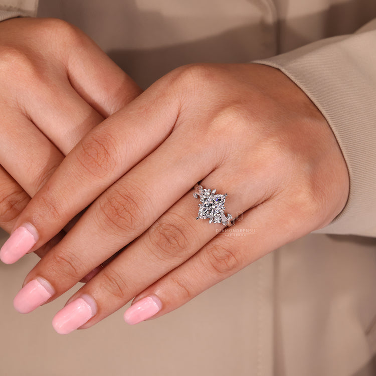 Six leaf style prong marquise diamond ring.