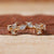 Close-up of a diamond wedding band with round and marquise diamonds set in gold Close-up of a diamond wedding band with round and marquise diamonds set in gold