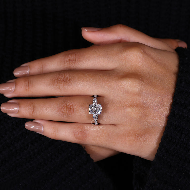 Pear side stone ring set in hidden halo engagement ring.