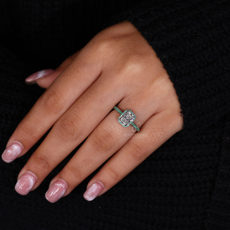 IGI certified radiant diamond ring with emerald halo and claw prong setting.