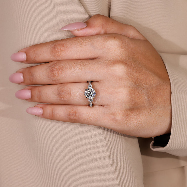 Lab grown diamond 3 stone ring with milgrain setting.