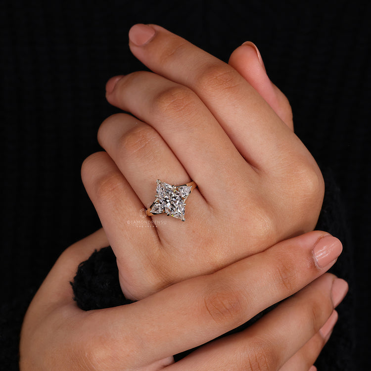 Pear side stone in 3 stone engagement ring.
