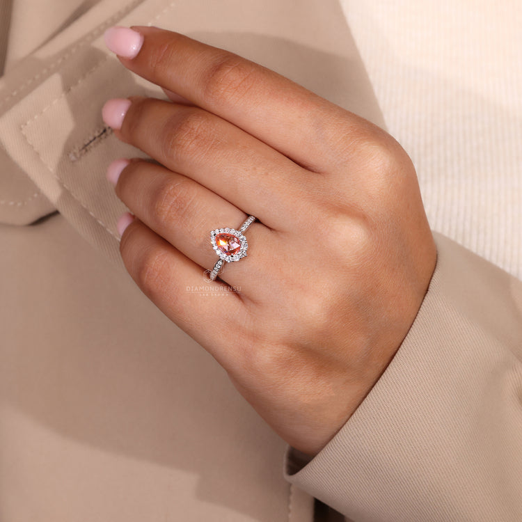 Custom diamond ring with pear rose cut and pavé halo setting.