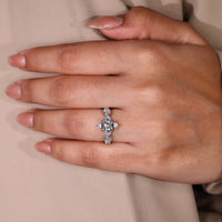 Zig zag pavé ring with marquise diamond and six claw prong setting.