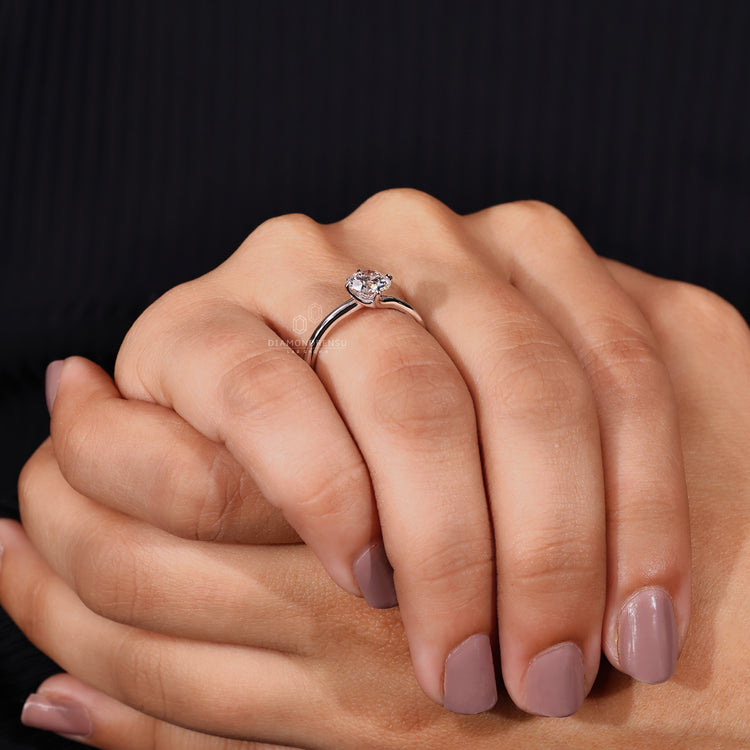 Simple engagement ring paired with round diamond engagement ring.