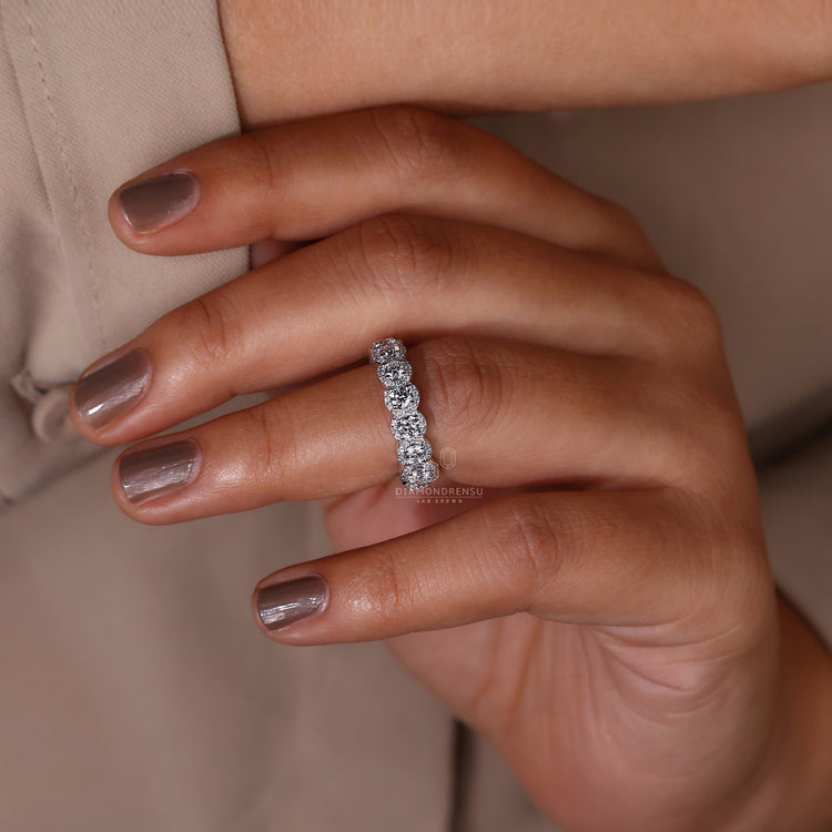 Prong setting on white gold wedding band.
