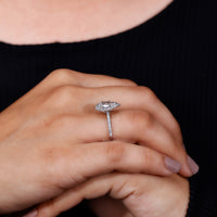 halo engagement ring in round prong setting.