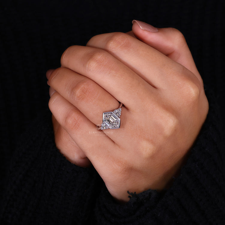 Round cut side stones ring designed in bezel set diamond ring.