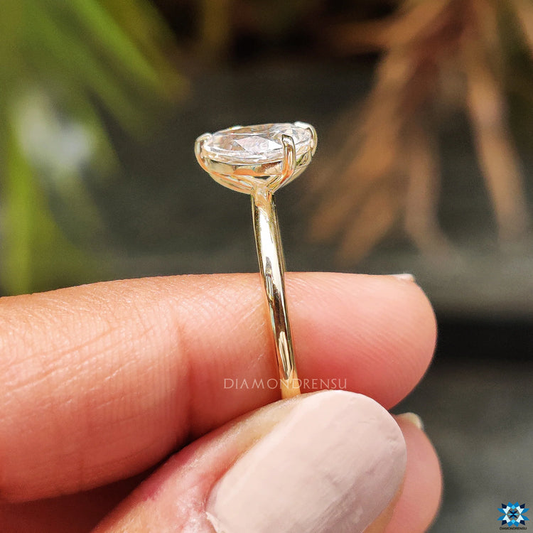 Pear shaped engagement ring adds sophistication.