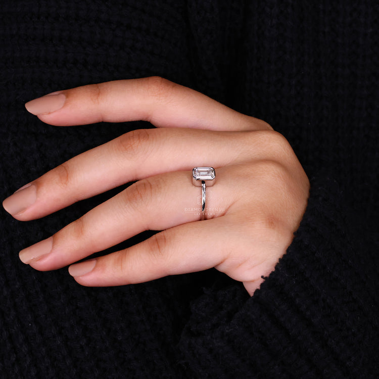 Buy engagement ring featuring emerald cut diamond ring.