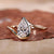 Pear shaped engagement ring in yellow gold with a unique design Pear shaped engagement ring in yellow gold with a unique design