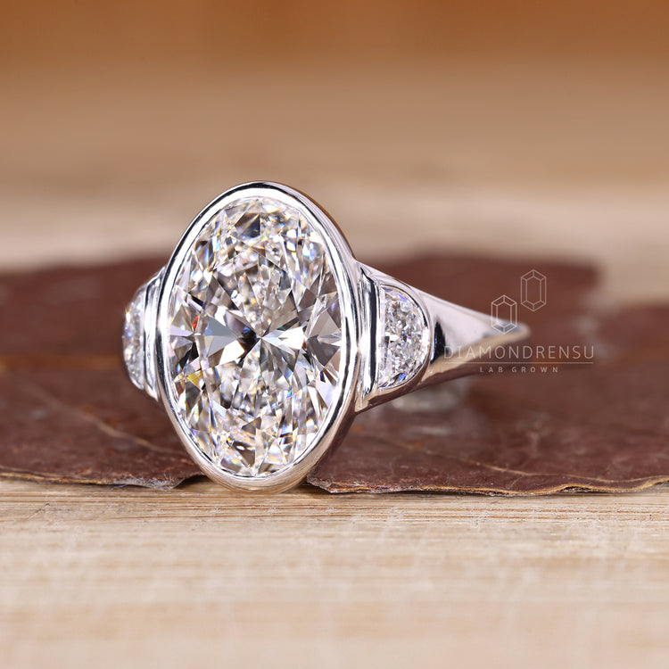 Three stone oval cut ring with half moon stones.