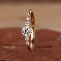 5 stone diamond ring in yellow gold band.
