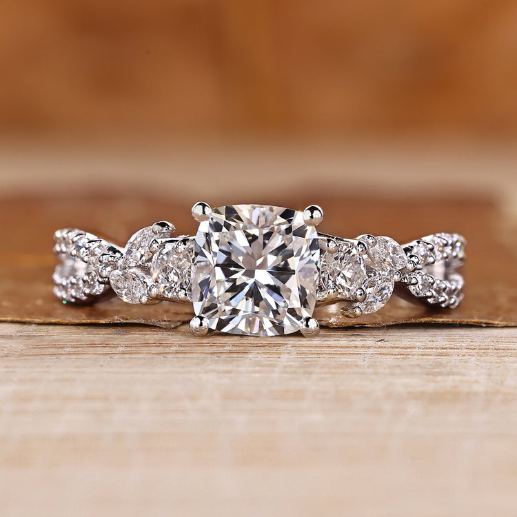 Cushion cut diamond ring marquise and round side stones.