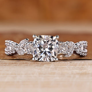 Cushion cut diamond ring marquise and round side stones.