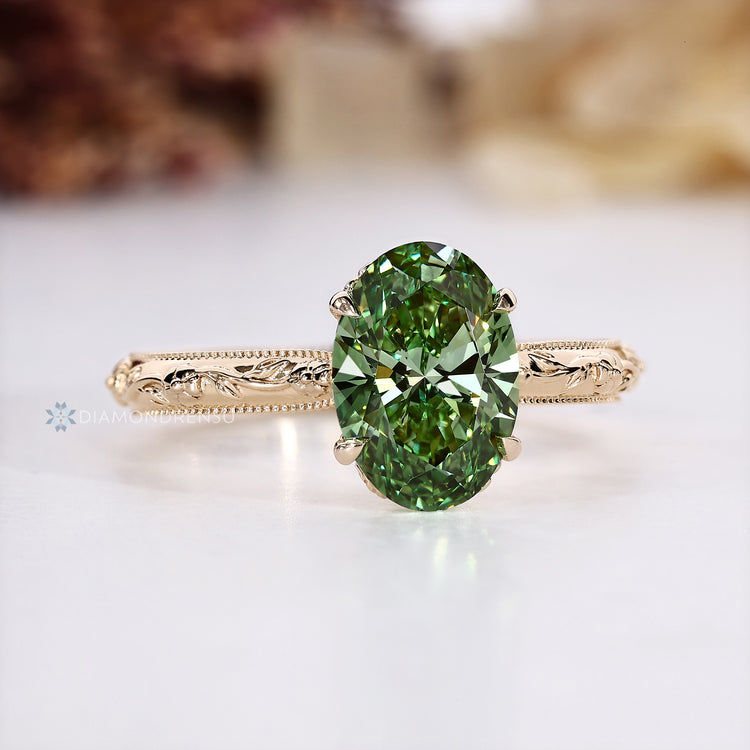 Oval diamond ring with four claw prong setting.