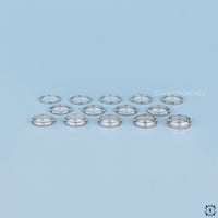 White gold band with a polished finish.