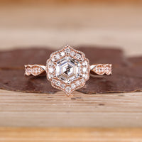 Hexagon Cut Diamond Ring with pave round diamonds.