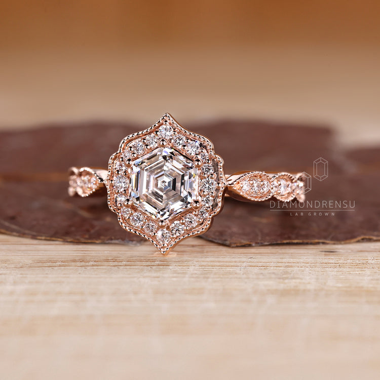 Hexagon Cut Diamond Ring with milgrain detailing.