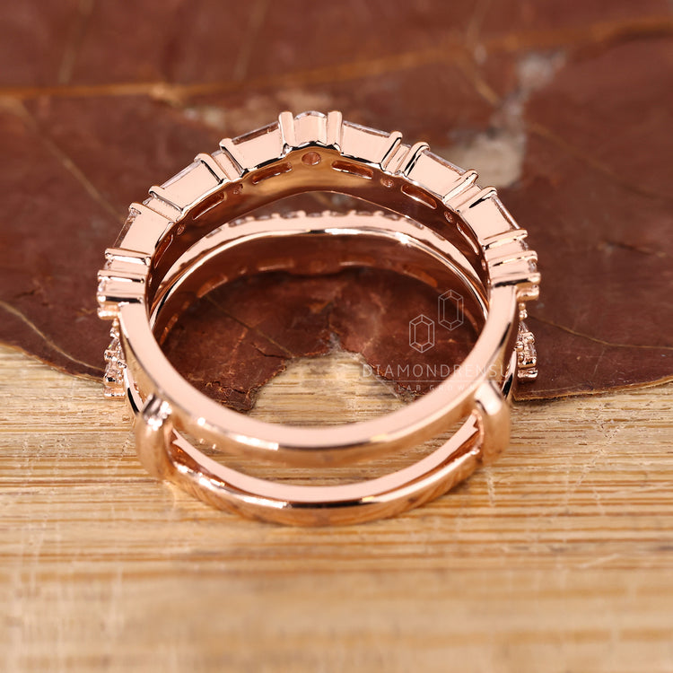 Rose gold wedding band with wrap guard band.