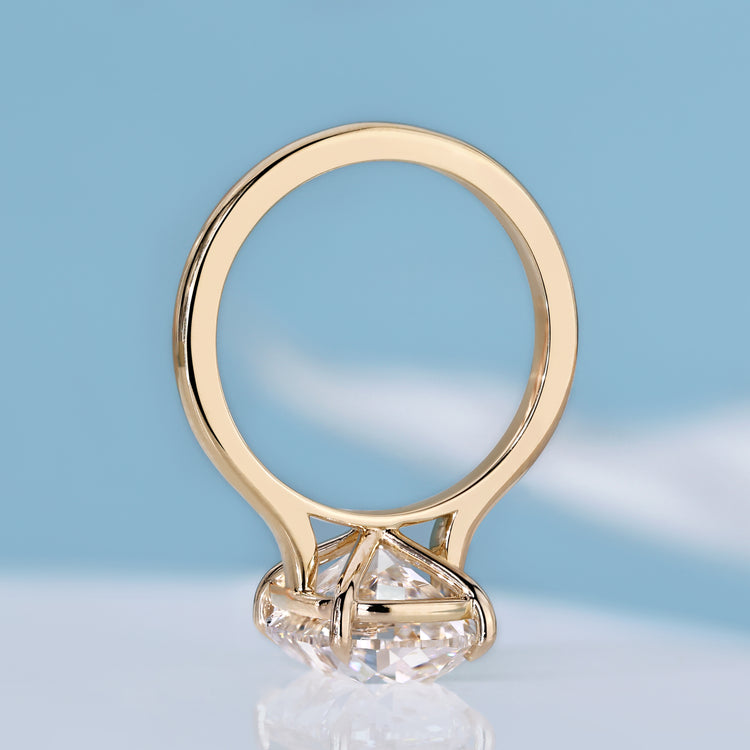 Solitaire cushion old mine cut diamond engagement ring.