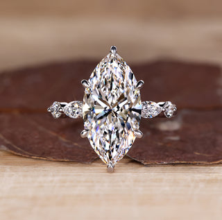 5 stone diamond ring with marquise centre and round side stones.