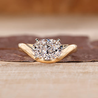 Oval cut lab grown diamond solitaire ring with elegant wavy band