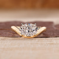 Oval cut lab grown diamond solitaire ring with elegant wavy band