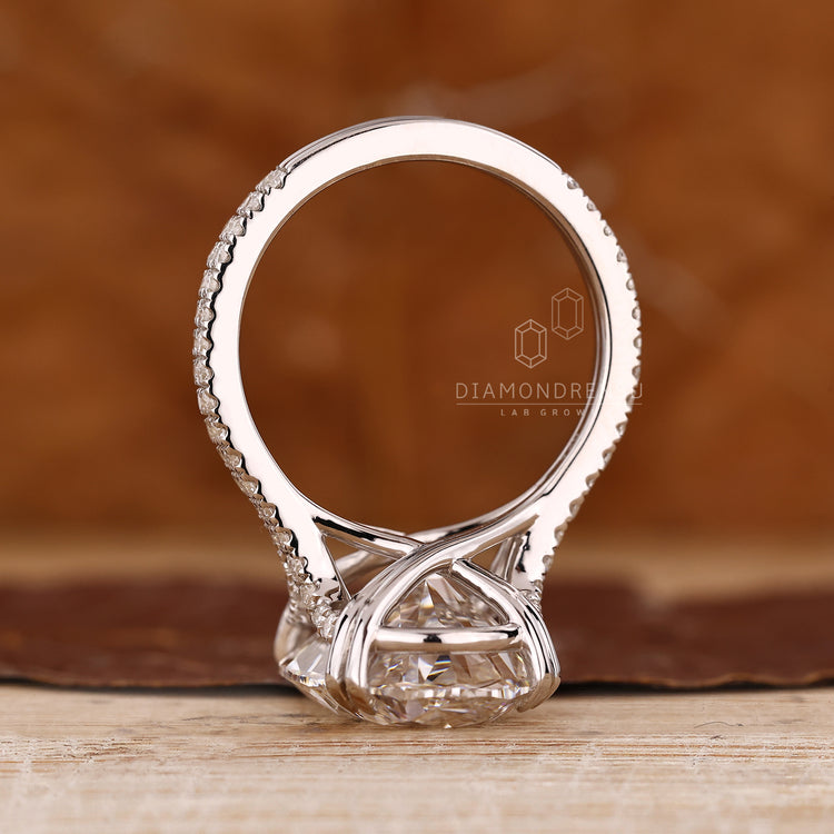 Handmade ring with oval diamond and double row pave design.