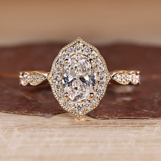 Oval Cut Diamond Ring with pave round diamonds.