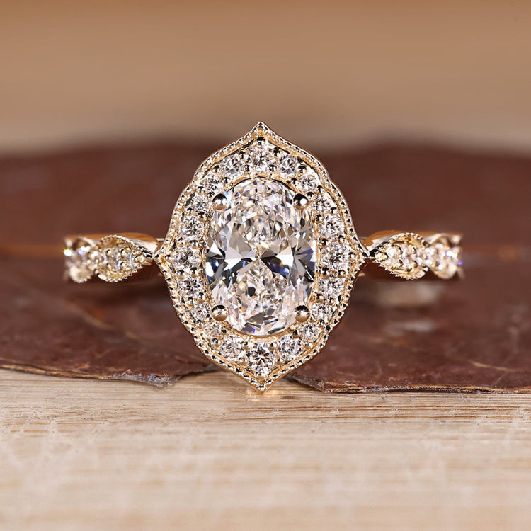 Oval Cut Diamond Ring with pave round diamonds.