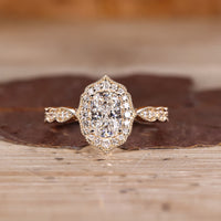 Cushion Cut Diamond Ring with pave round diamonds.
