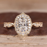 Cushion Cut Diamond Ring with pave round diamonds.