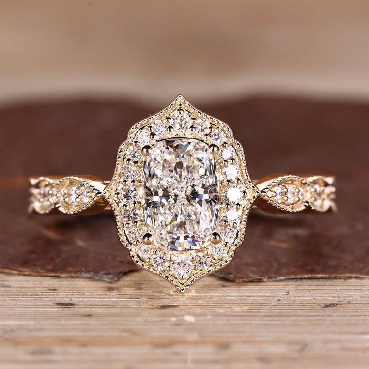 Cushion Cut Diamond Ring with pave round diamonds.