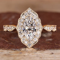 Marquise Diamond Ring with pave round diamonds.