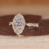 Marquise Diamond Ring with milgrain edge detail.