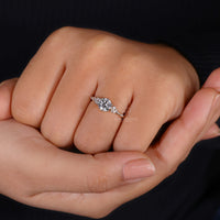 Prong setting ring holding round cut diamonds.