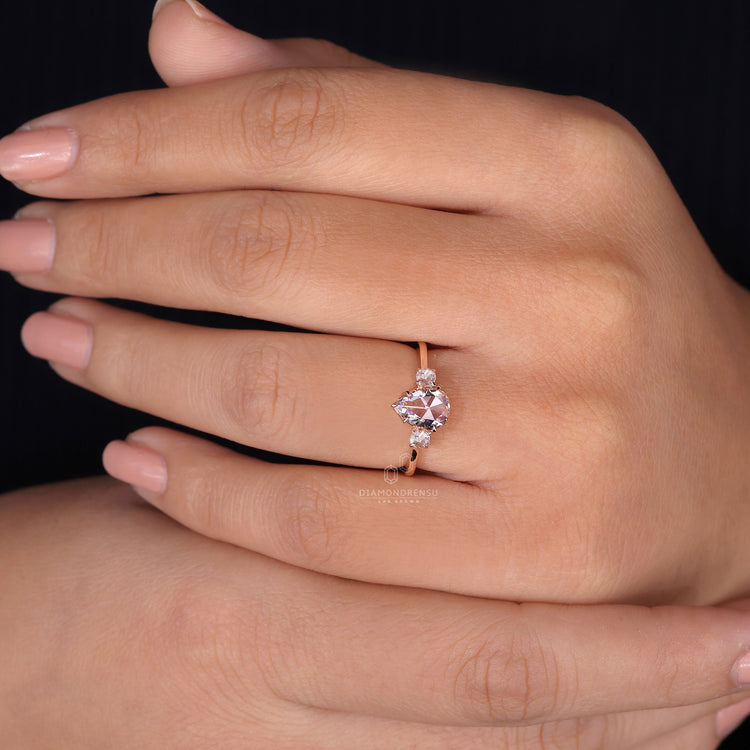 Customise ring with round rose cut side stones.