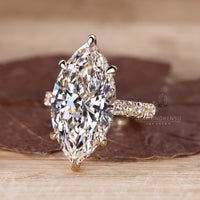 Pave round diamond ring with marquise centre stone.
