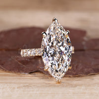 Custom diamond ring with marquise cut and hidden halo.