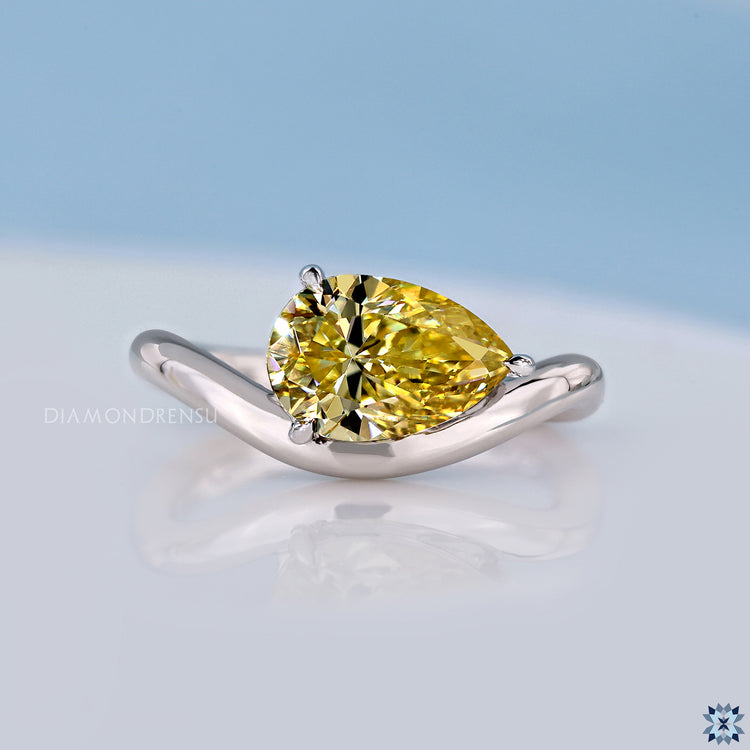 Pear diamond ring in east to west setting with solitaire style.