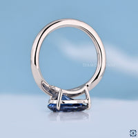 Pear cut solitaire moissanite ring with modern handmade finish.