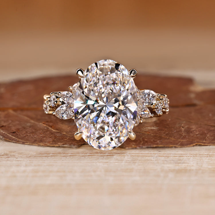 Oval Cut Diamond Ring with marquise and round stones.