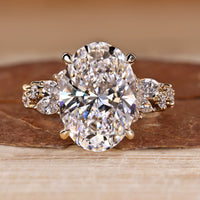 Oval Cut Diamond Ring with marquise and round stones.