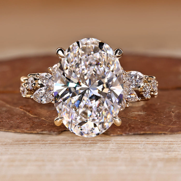 Oval Cut Diamond Ring with marquise and round stones.