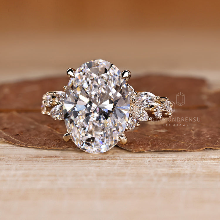 Oval Cut Diamond Ring marquise and round side stones.