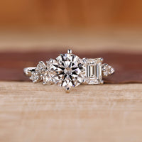 Round cut diamond ring with six tab prong setting.
